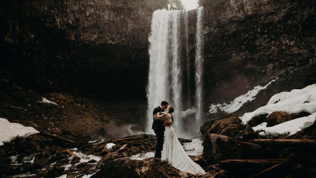 A bride and groom at Tamanawas Falls after their Mt Hood elopement.