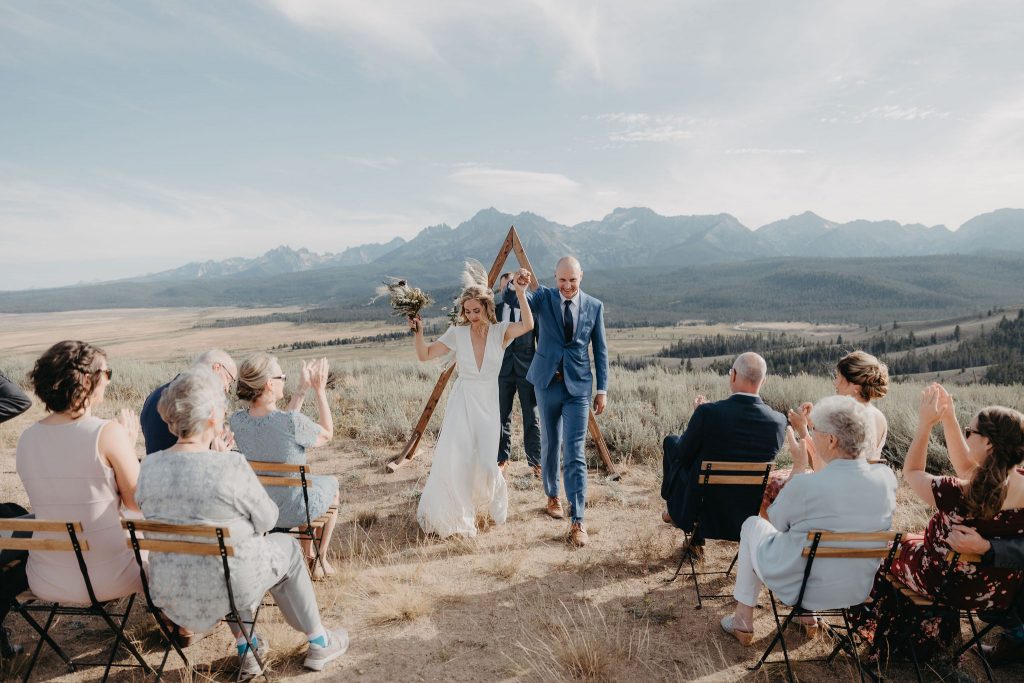 A bride and groom celebrating their elopement in the Sawtooth Mountains.