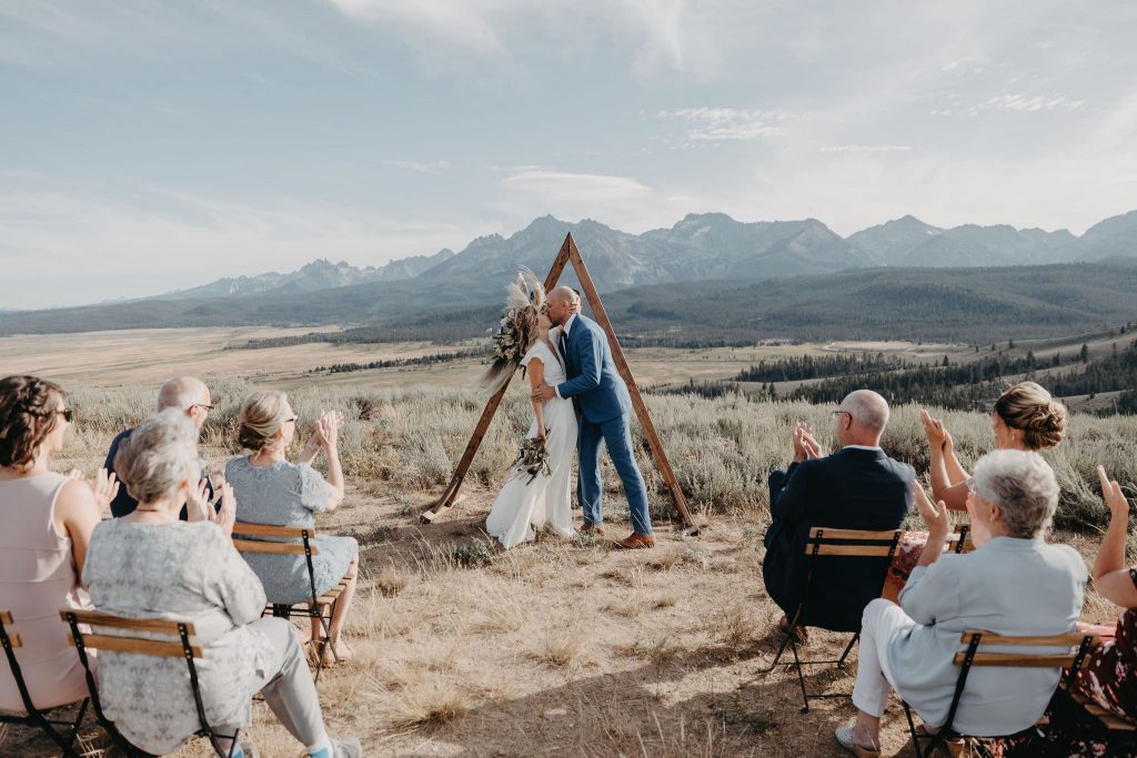 A first kiss photo of an elopement in the Sawtooth Mountains.
