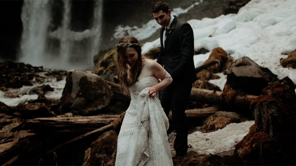 A bride and groom at Tamanawas Falls after their Mt Hood elopement.