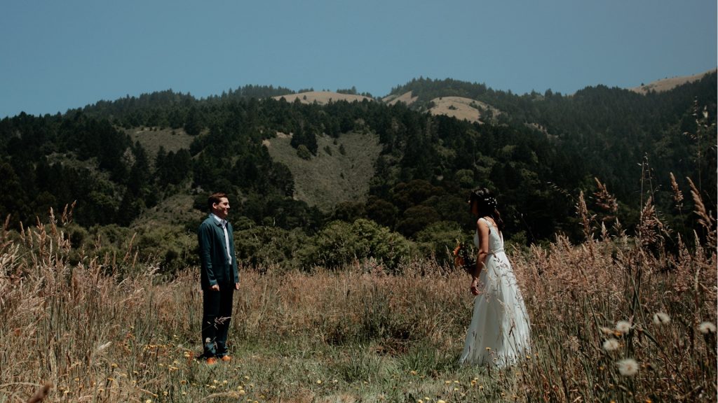 A bride and groom having their first look before their redwoods wedding at Old Mill Park.