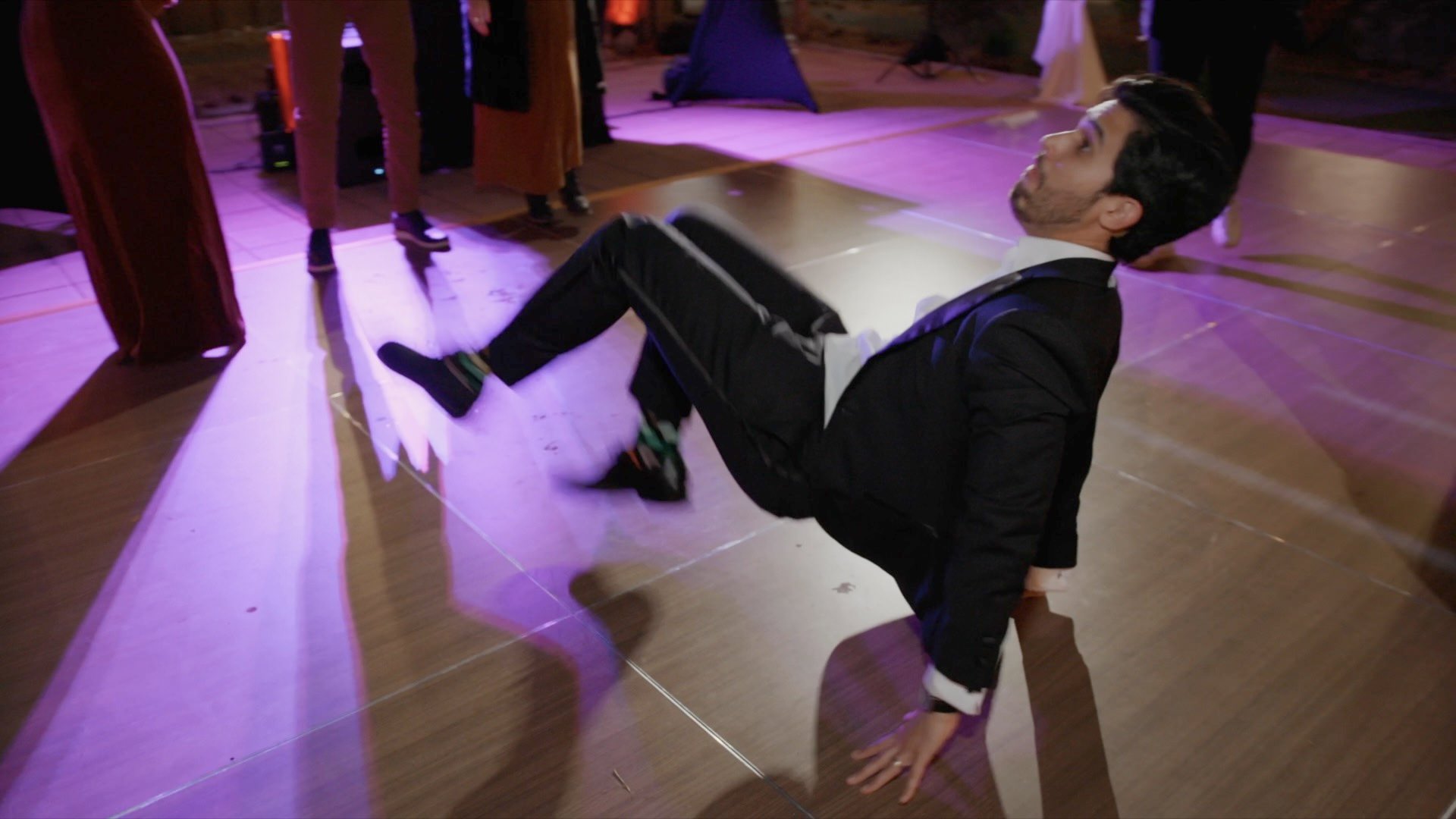 groom kicking the dance floor