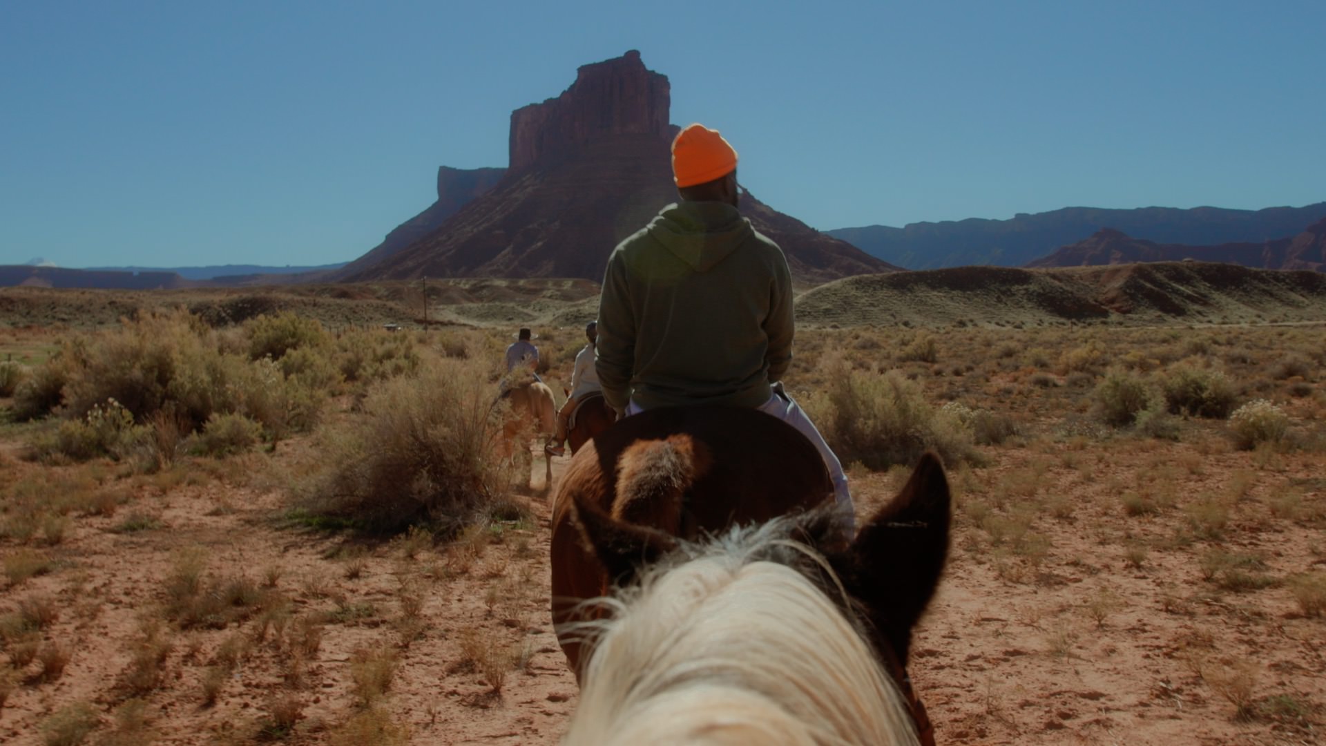 man riding horse in Moab