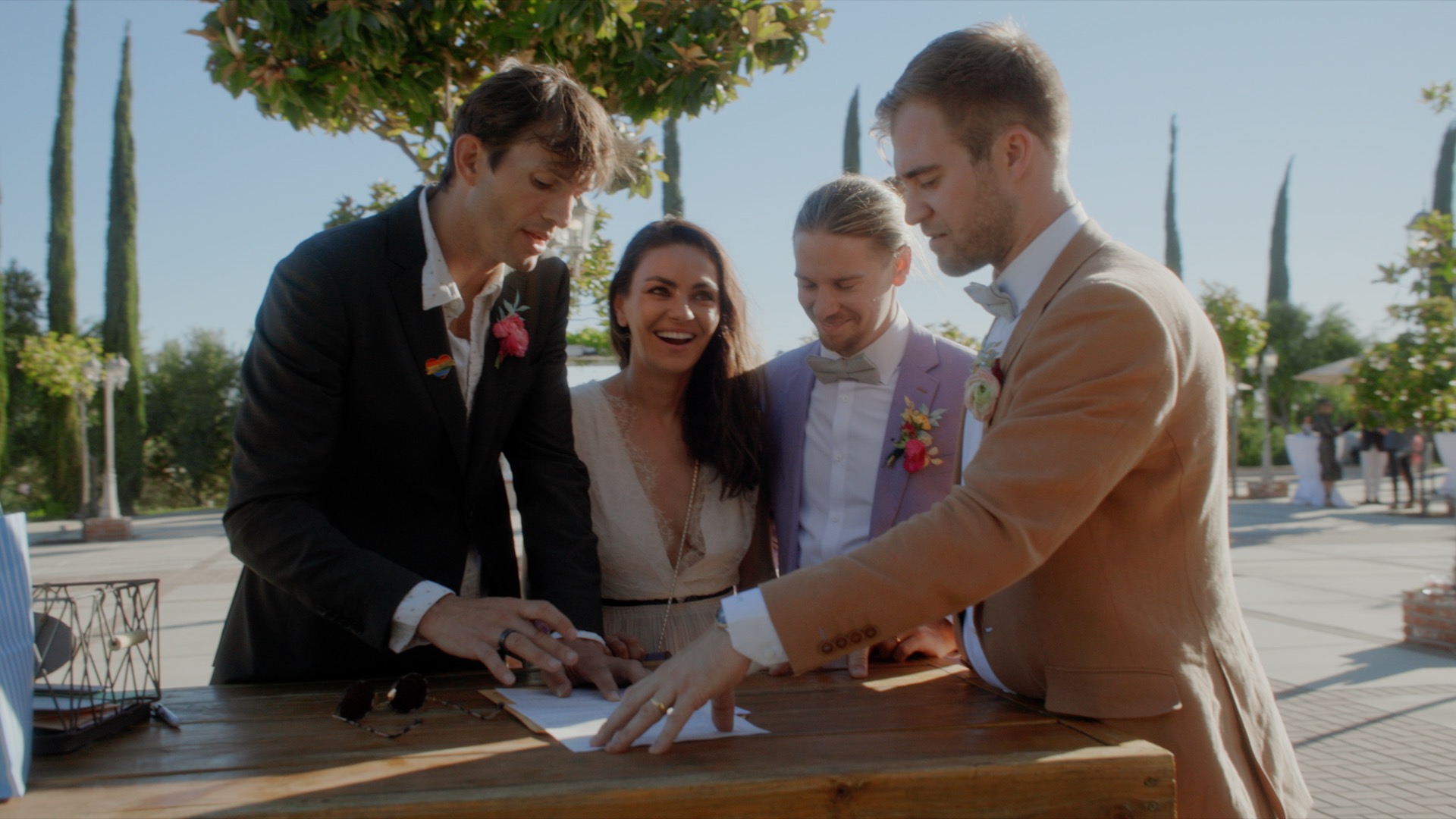 Ashton Kutcher and mila Kunis signing as witnesses to pk and mike's wedding in Temecula