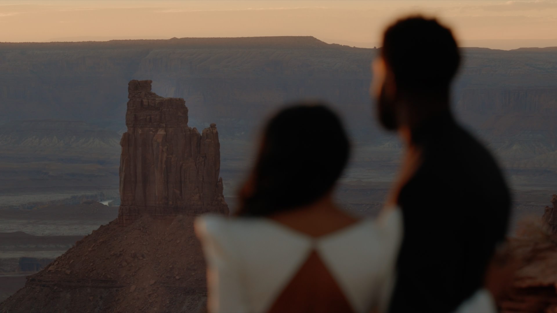a man and woman gazing at canyonlands national park