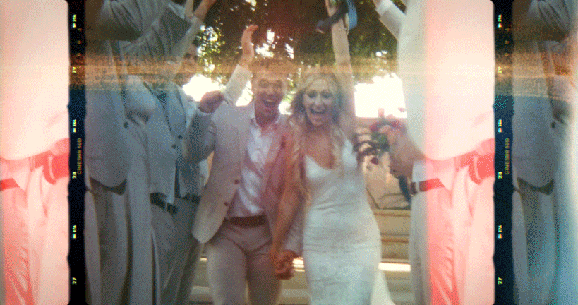 a 3d photo of a couple running through a bridal party tunnel