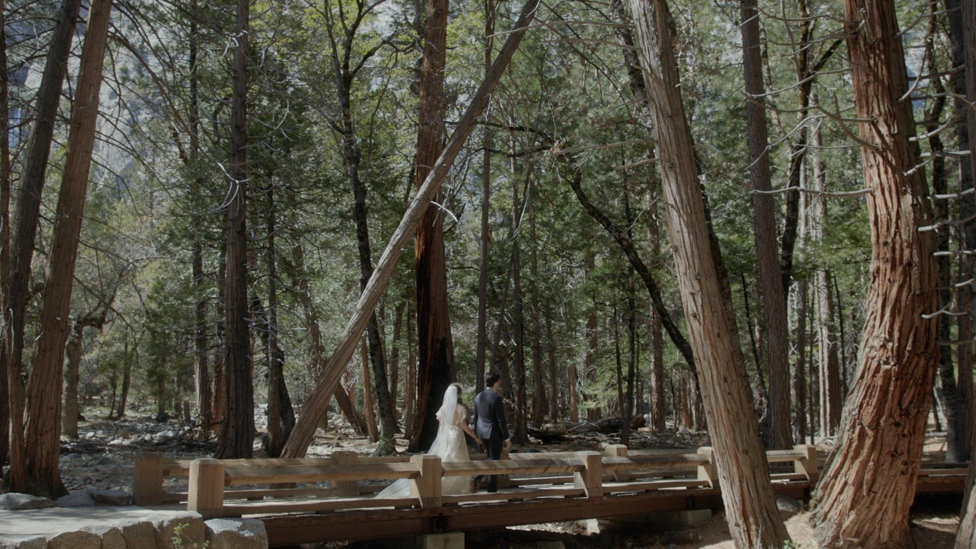 couple walking through Yosemite Falls trail